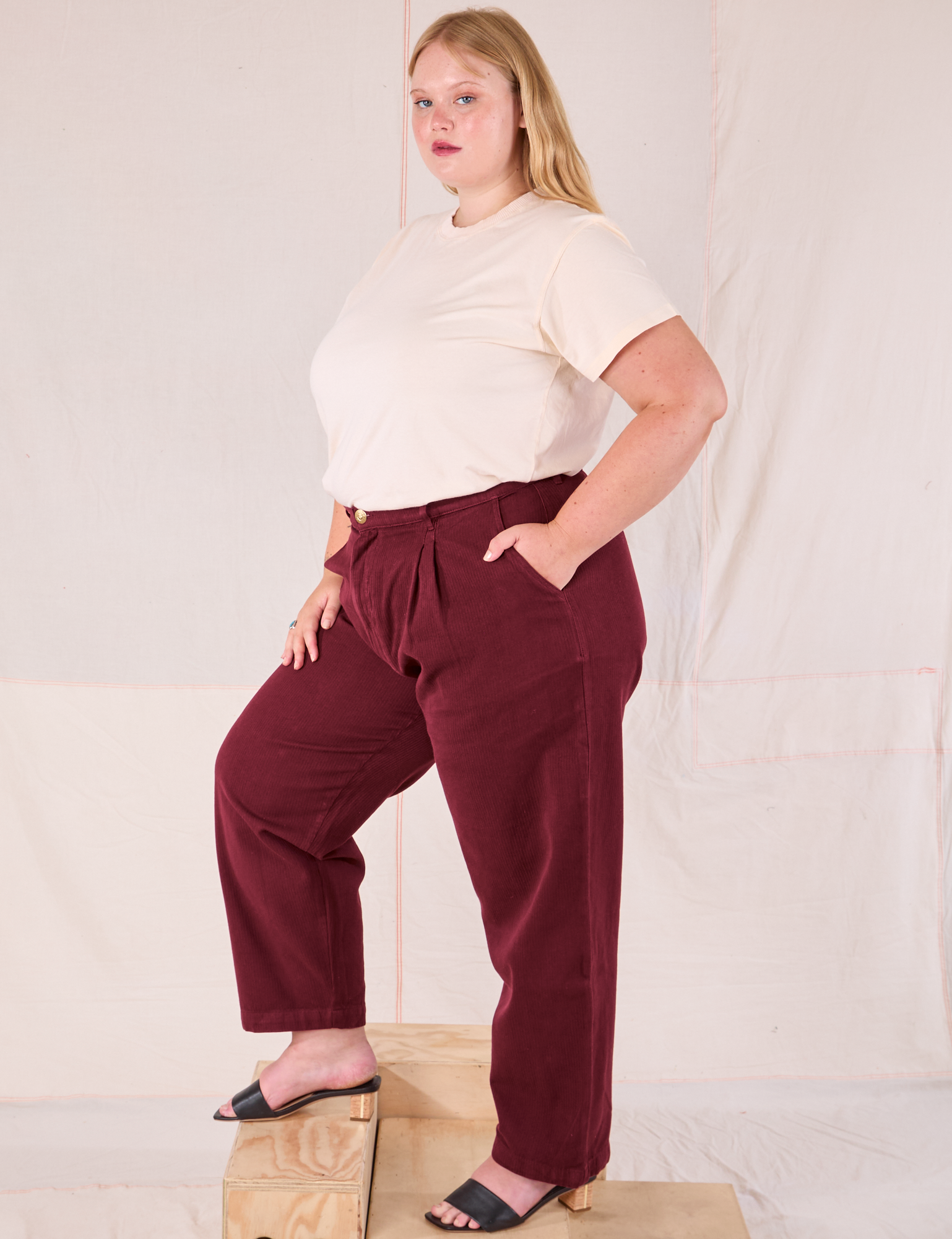 Side view of Heritage Trousers in Red Wine and Organic Vintage Tee on Juliet