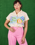 Tiara is wearing XS Pantry Button-Up in Lace Airbrush tucked into bubblegum pink Western pants