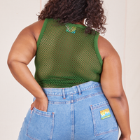 Back view of Mesh Tank Top in Lawn Green and light wash Frontier Jeans worn by Morgan