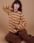 Long Sleeve Striped Burly Tee in Orange and Drop Pocket Cargo Pants in Fudgesicle Brown on Alex