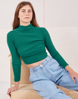 Scarlett is 5'9" and wearing P Essential Turtleneck in Hunter Green