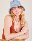 Margaret is wearing Wide Brim Denim Bucket Hat in light wash