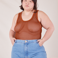 Ashley is 5'7" and wearing L Mesh Tank Top in Burnt Terracotta