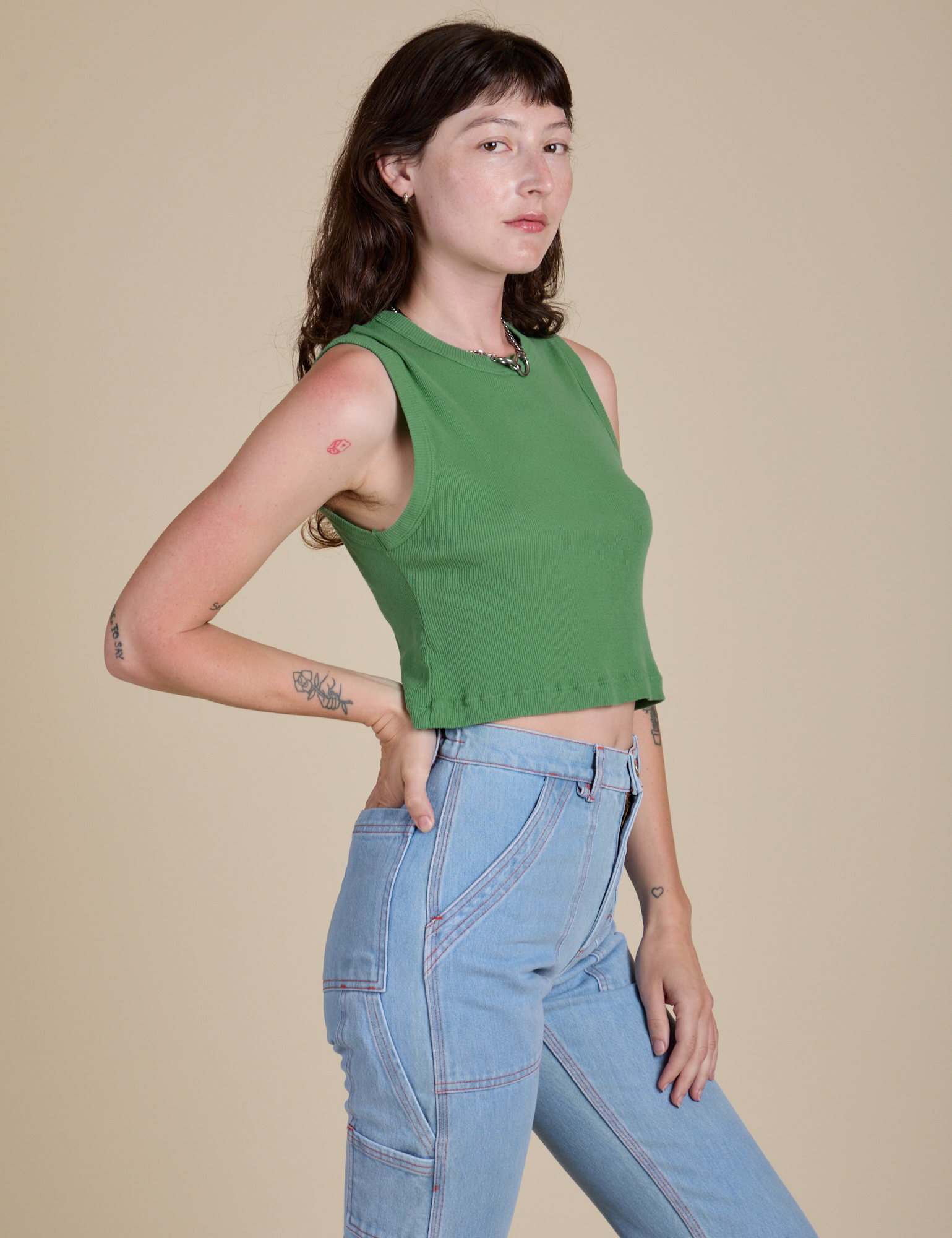 Angled front view of Muscle Tee in Seafoam Green on Alex