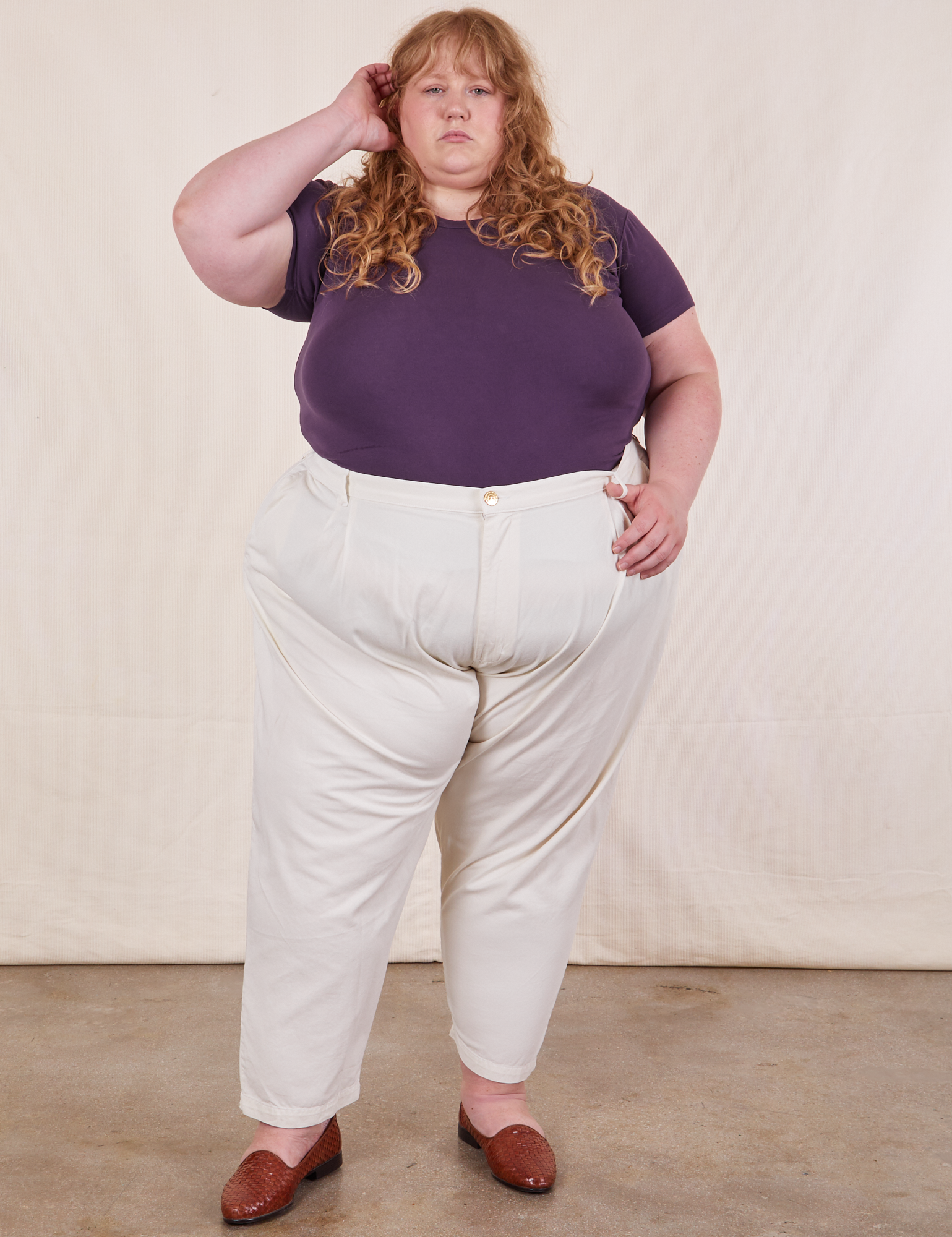 Catie is wearing Baby Tee in Nebula Purple and vintage off-white Trousers