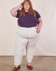 Catie is wearing Baby Tee in Nebula Purple and vintage off-white Trousers