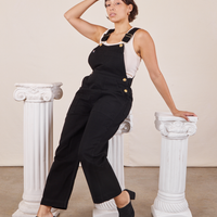 Tiara is wearing Original Overalls in Mono Black and a vintage off-white Cropped Tank Top underneath.