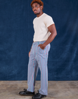 Side view of Stripe Work Pants in Blue Raspberry and Organic Vintage Tee in vintage tee off-white on Issac