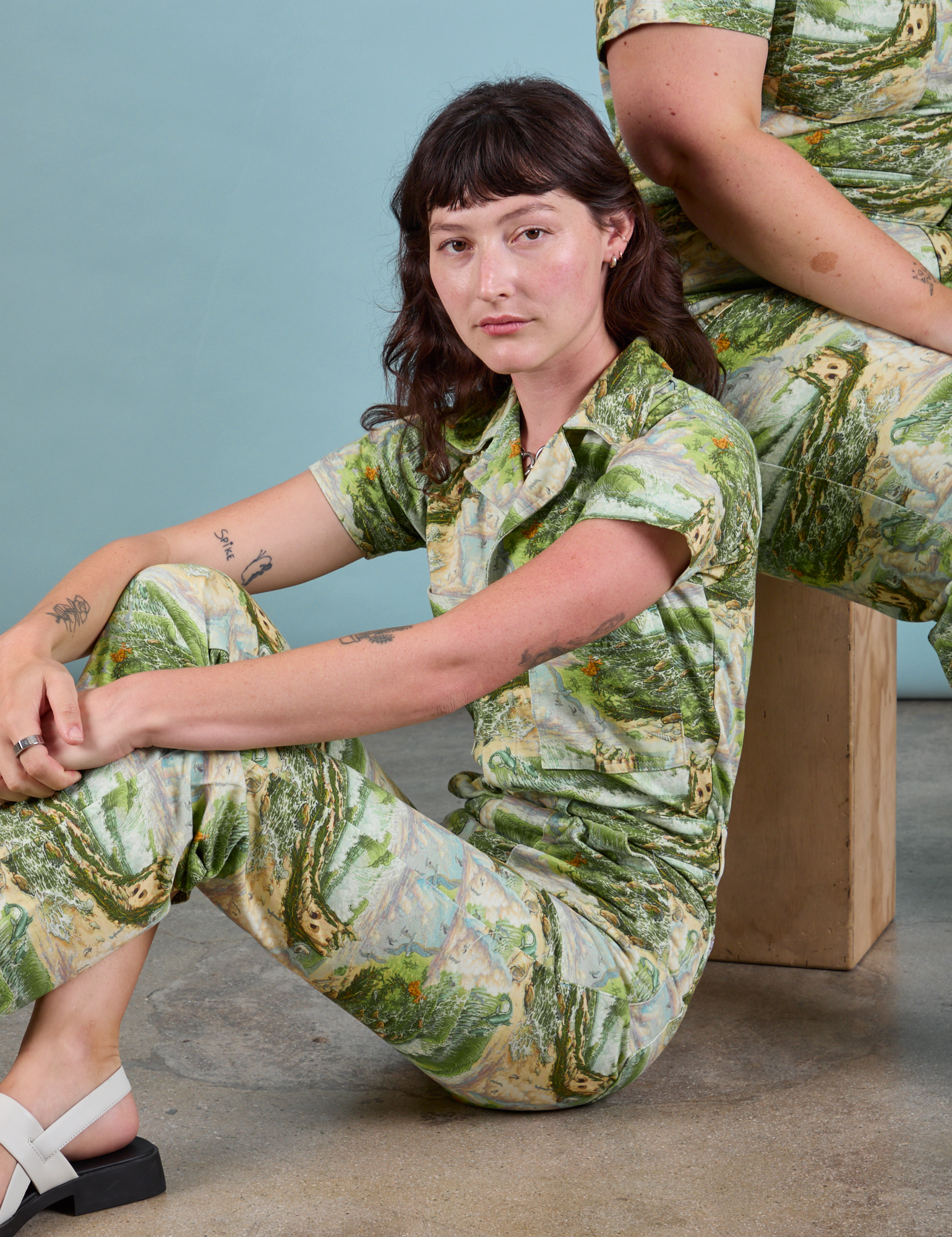 Alex is wearing Ocean and Sky Jumpsuit