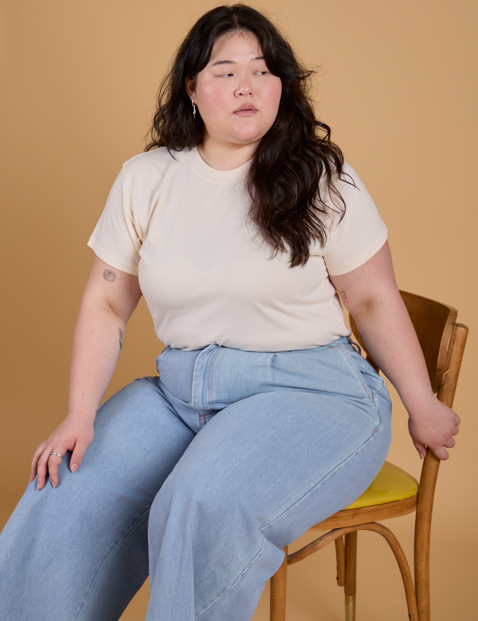 Organic Vintage Tee in Vintage Off White and light wash Indigo Wide Leg Trousers worn by Ashley