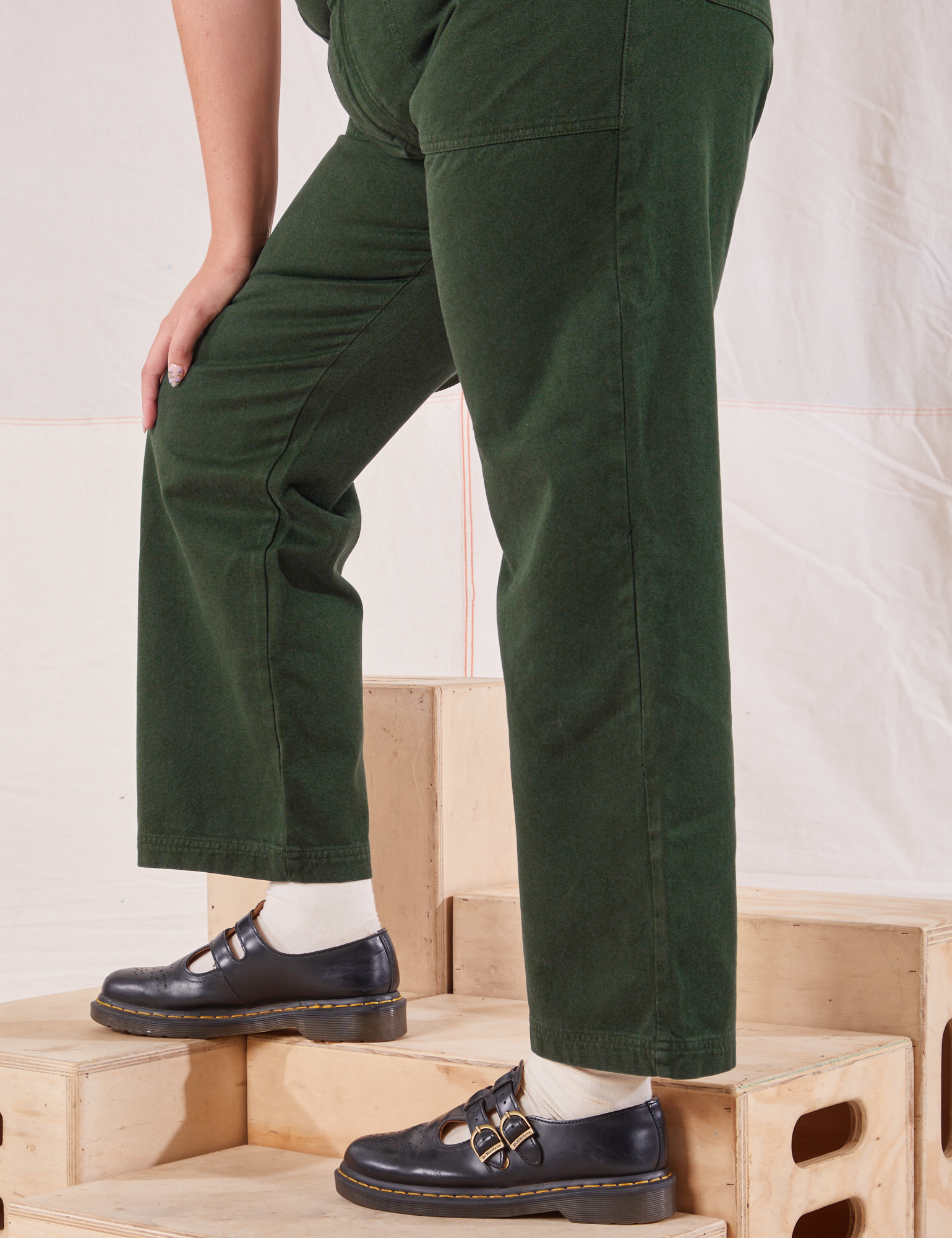 Organic Work Pants in Swamp Green side pant leg close up on Ryan