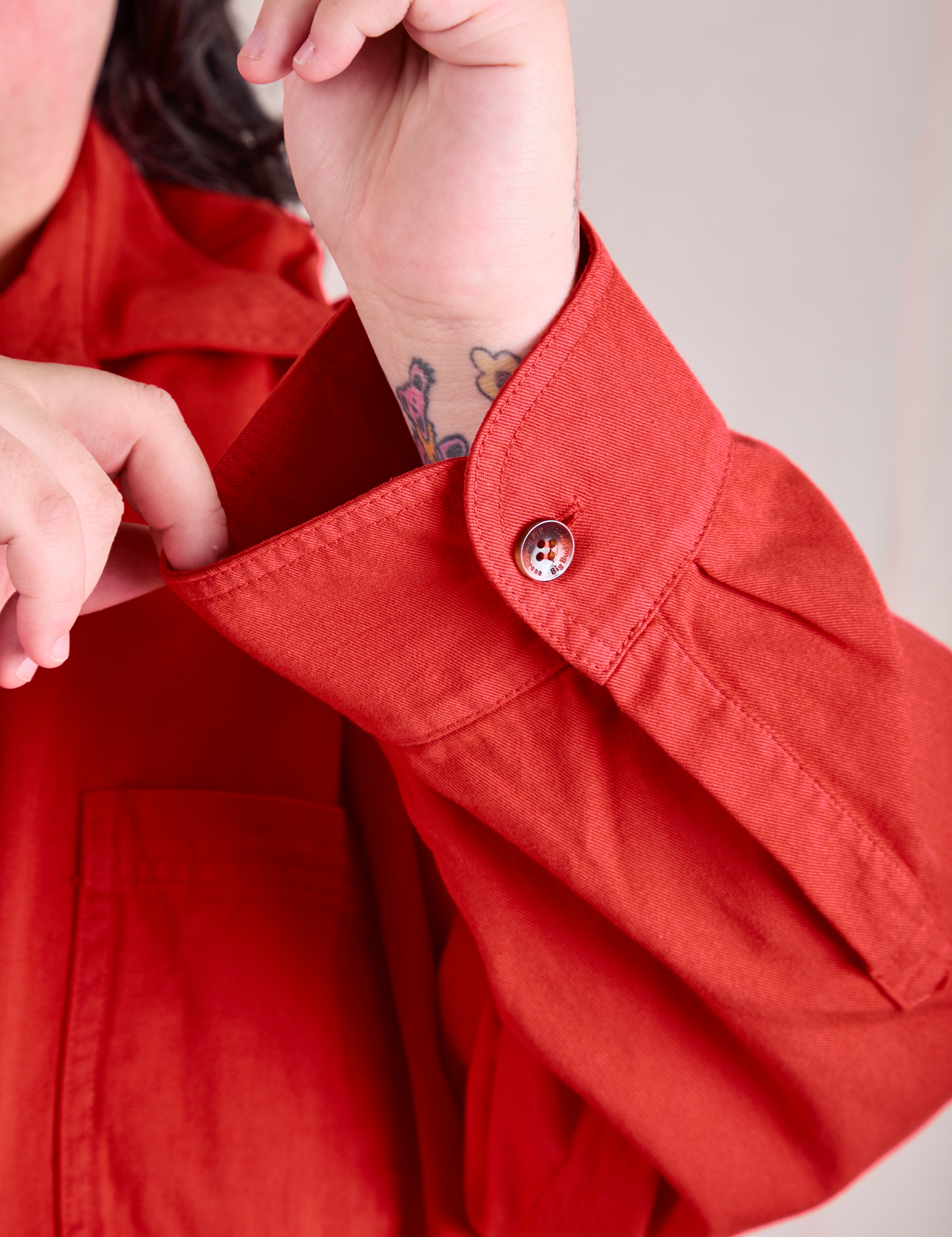 Sleeve close up of Twill Overshirt in Mustang Red on Sam