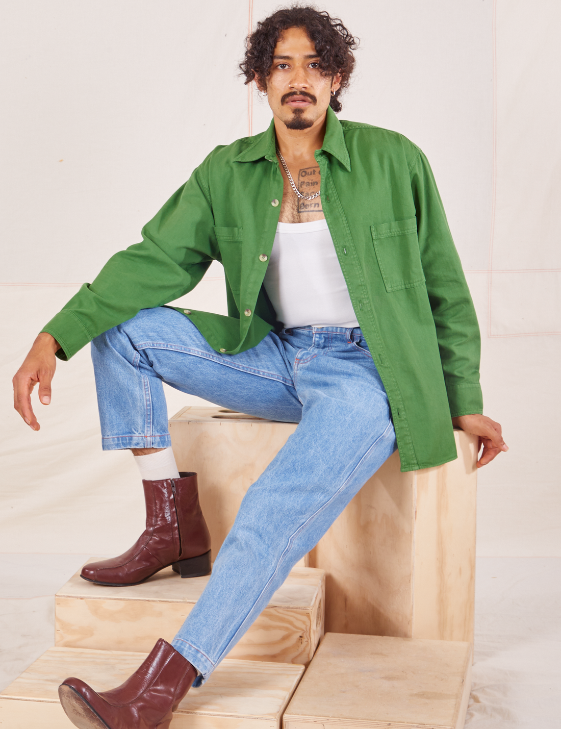 Jesse is wearing Oversize Overshirt in Lawn Green paired with vintage off-white Cropped Tank Top 
