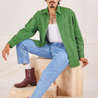 Jesse is wearing Oversize Overshirt in Lawn Green paired with vintage off-white Cropped Tank Top 