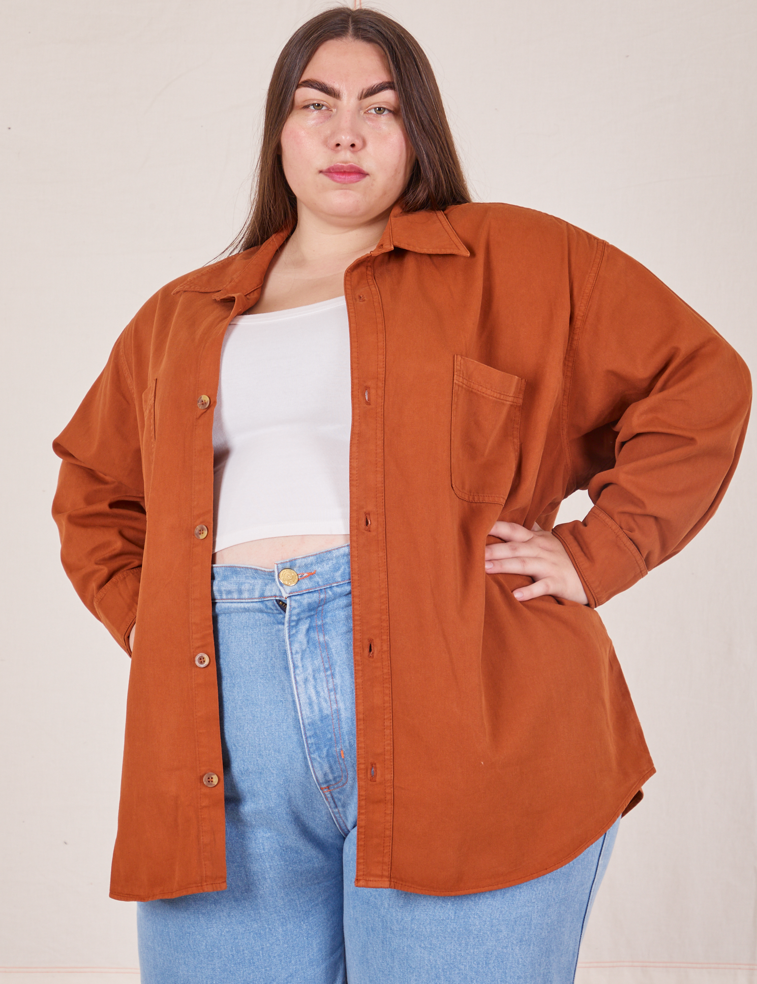 Marielena is wearing size 0XL Oversize Overshirt in Burnt Terracotta with vintage off-white Cropped Tank
