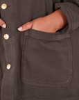 Field Coat in Espresso Brown front pocket close up. Morgan has her hand in the pocket.