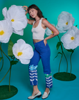 Side view of Paintstamped Work Pants in Daisy and Cropped Tank in Vintage Tee White on Alex