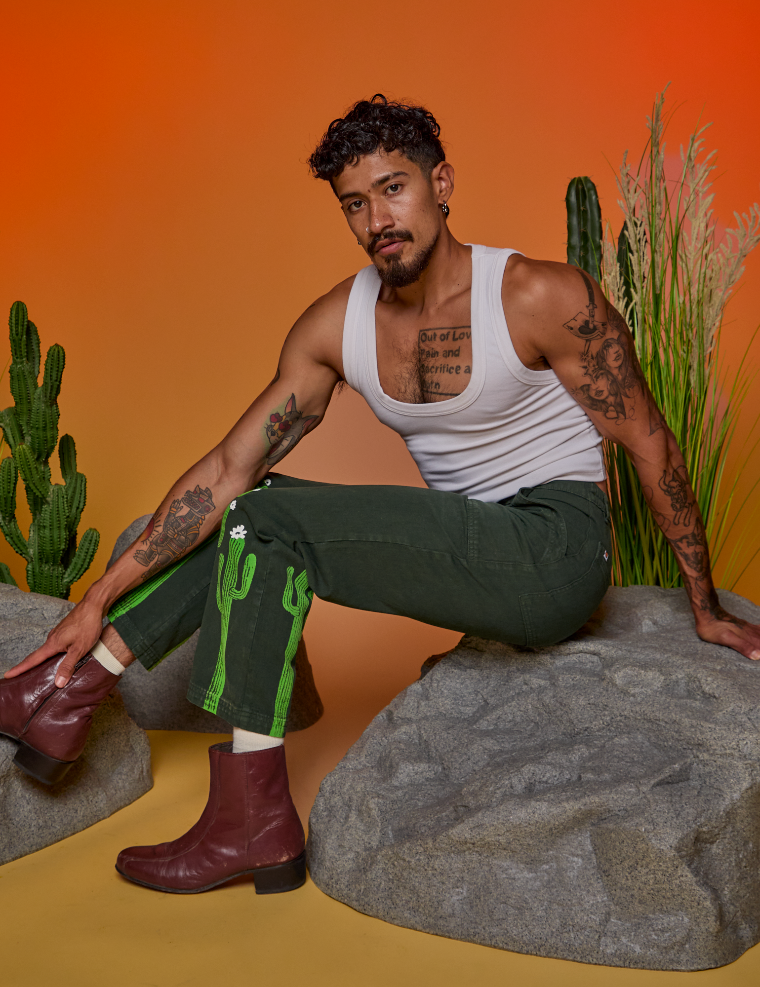 Jesse is wearing Paintstamped Work Pants in Cactus and Cropped Tank in Vintage Tee White