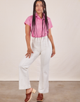 Gabi is wearing Pantry Button-Up in Bubblegum Pink and vintage off-white Western Pants