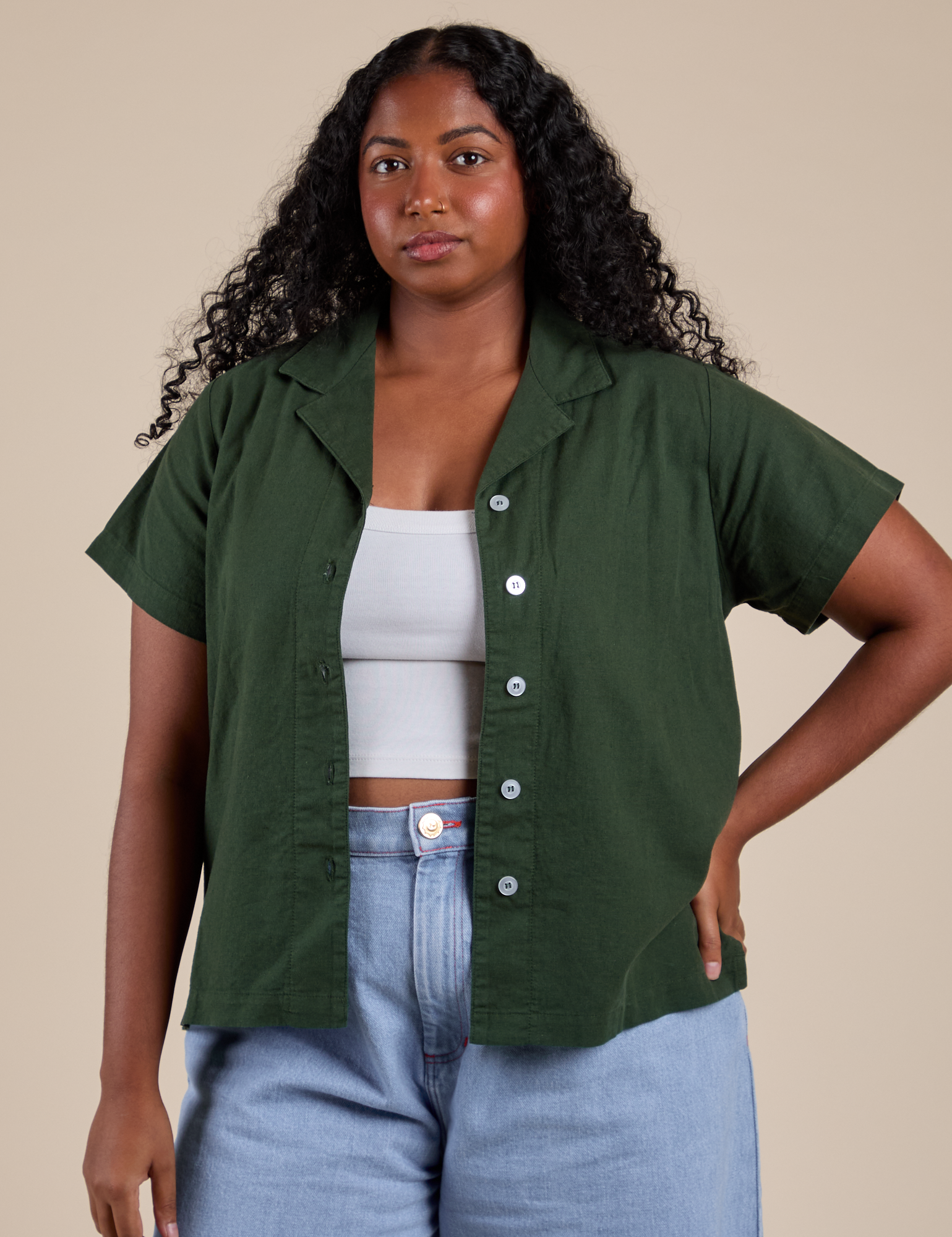 Meghna is 5’8” and wearing M Pantry Button-Up in Swamp Green