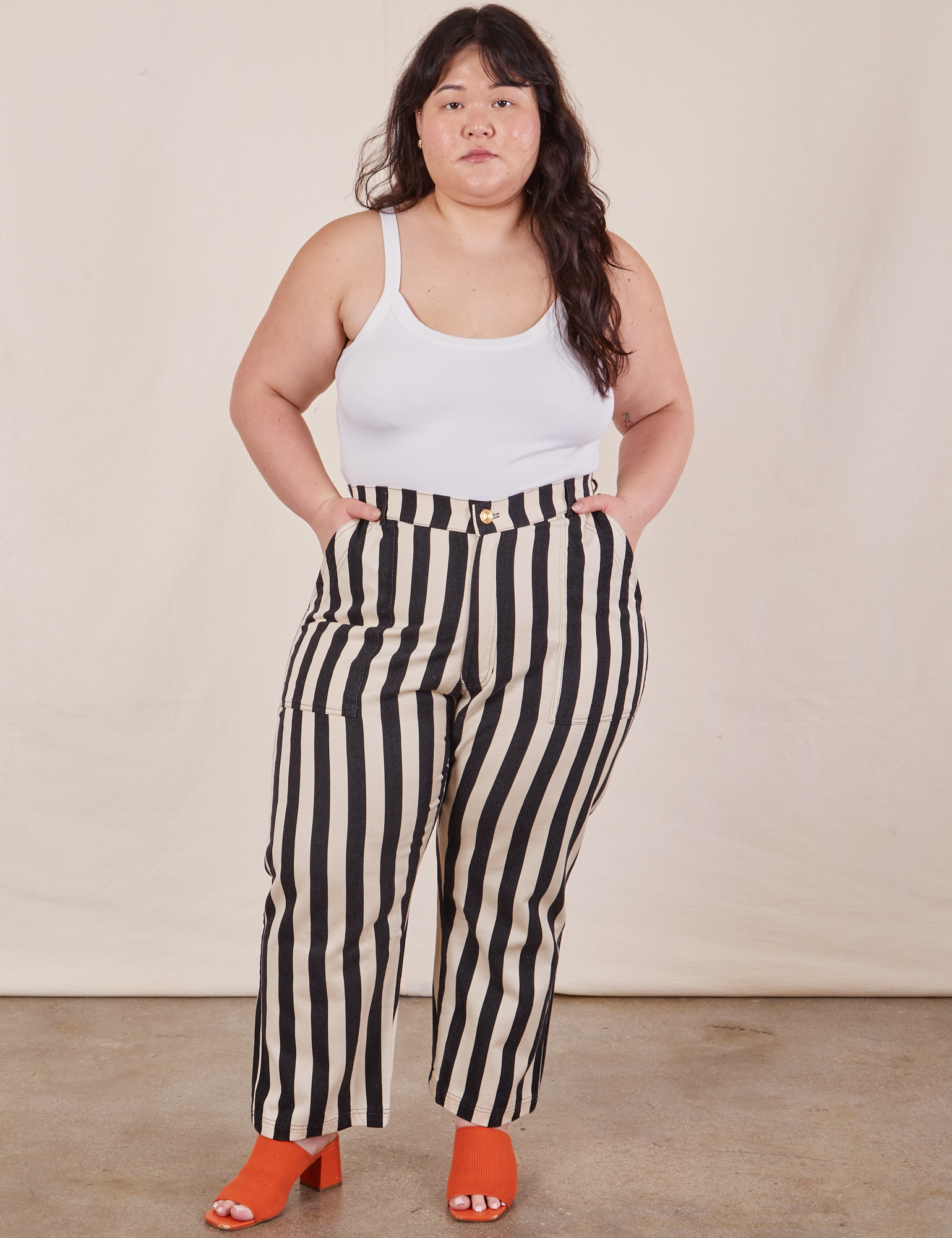 Ashley is 5’7” and wearing 1XL Petite Black Striped Work Pants in White paired with vintage off-white Cropped Cami