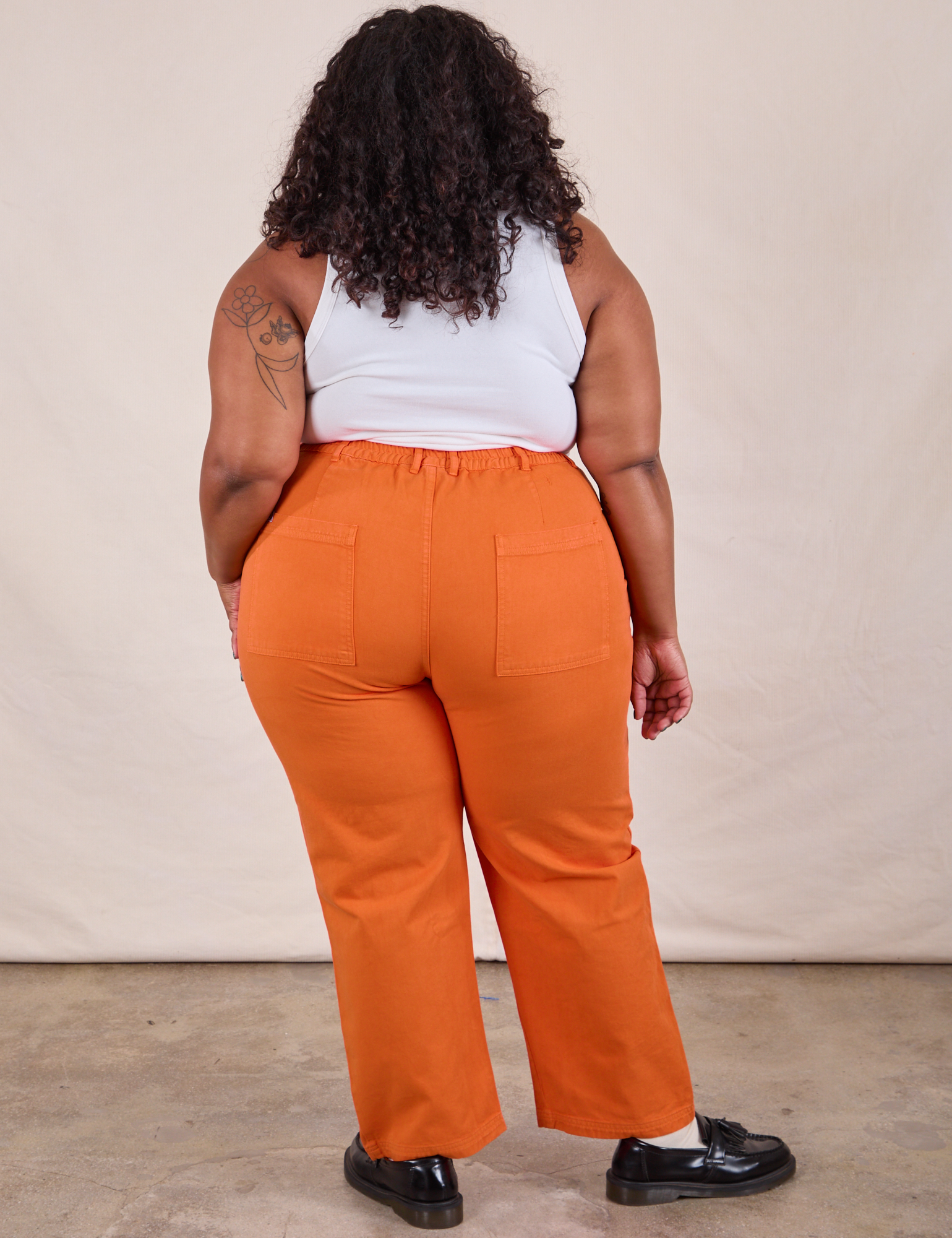 Work Pants in Construction Orange back view of Morgan