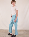 Side view of Work Pants in Baby Blue and Burly Tee in Vintage Tee Off-White on Quinn