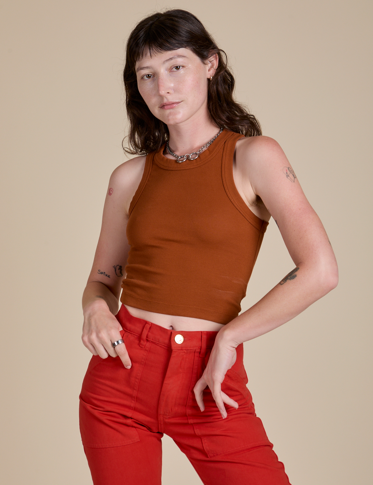 Alex is 5’8” and wearing P Racerback Tank in Burnt Terracotta