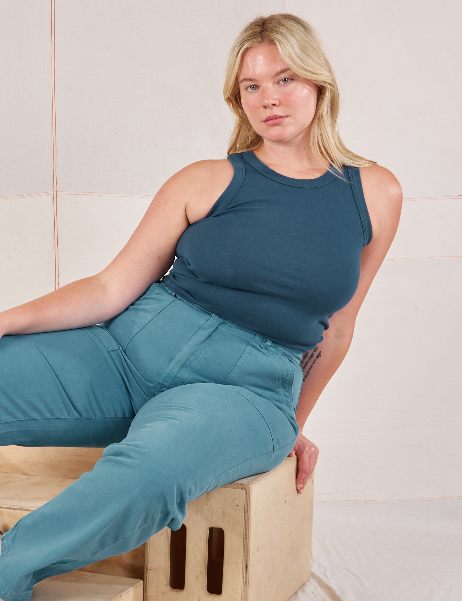 Lish is wearing Racerback Tank in Lagoon and marine blue Work Pants