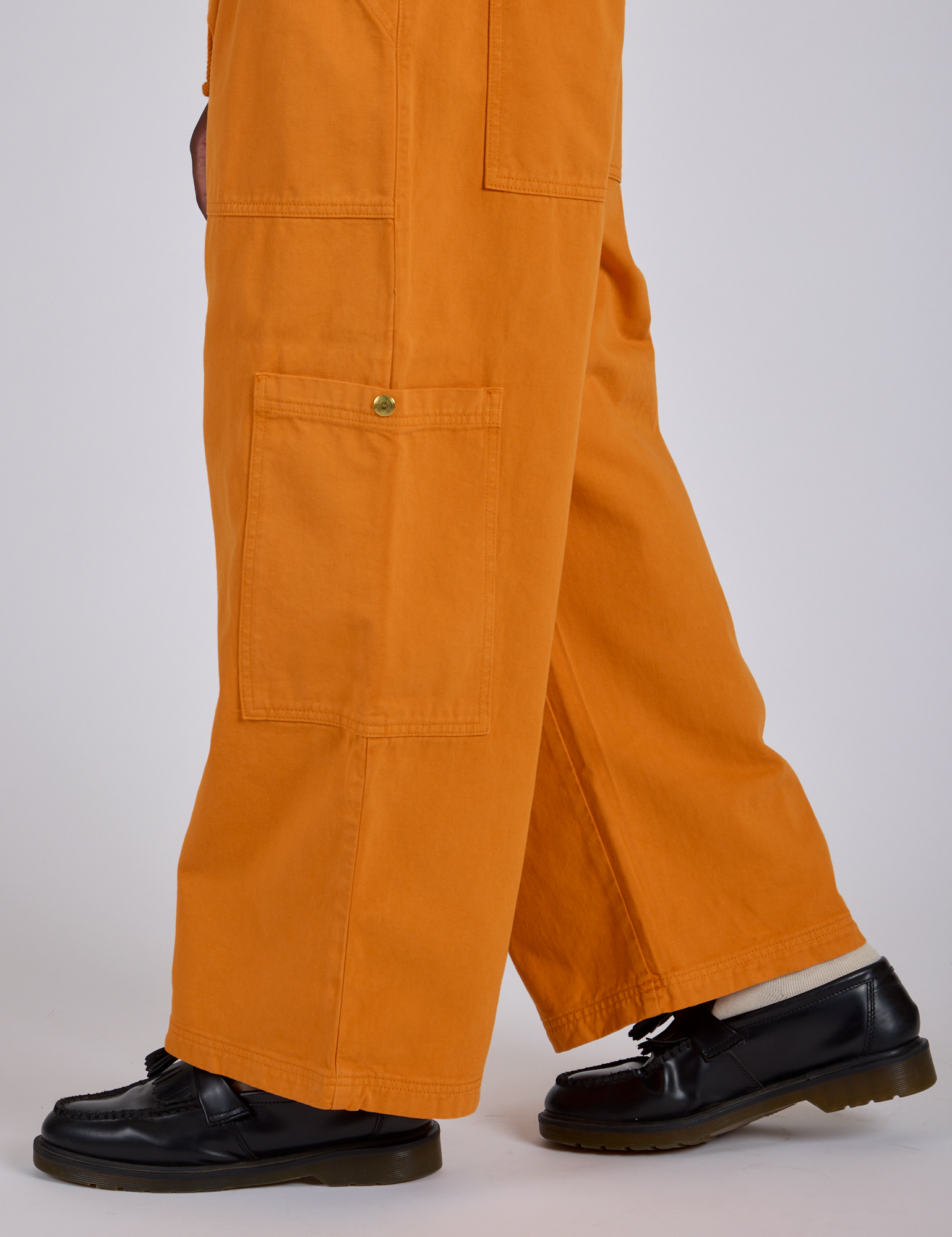 Drop Pocket Cargo Pants in Creamsicle Orange side pant leg close up on Isaac