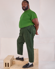 Side view of Mid-Rise Work Pants in Swamp Green and lawn green Organic Vintage Tee on Elijah