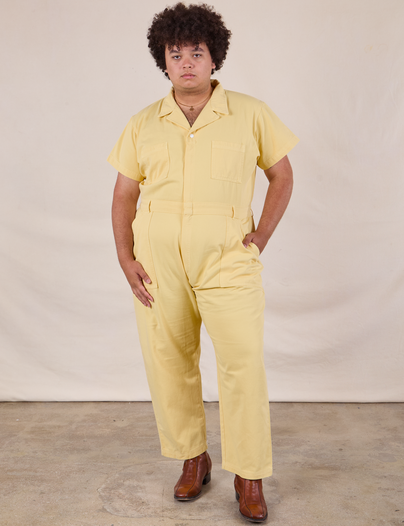 Miguel is 6&#39;0&quot; and wearing 2XL Short Sleeve Jumpsuit in Butter Yellow
