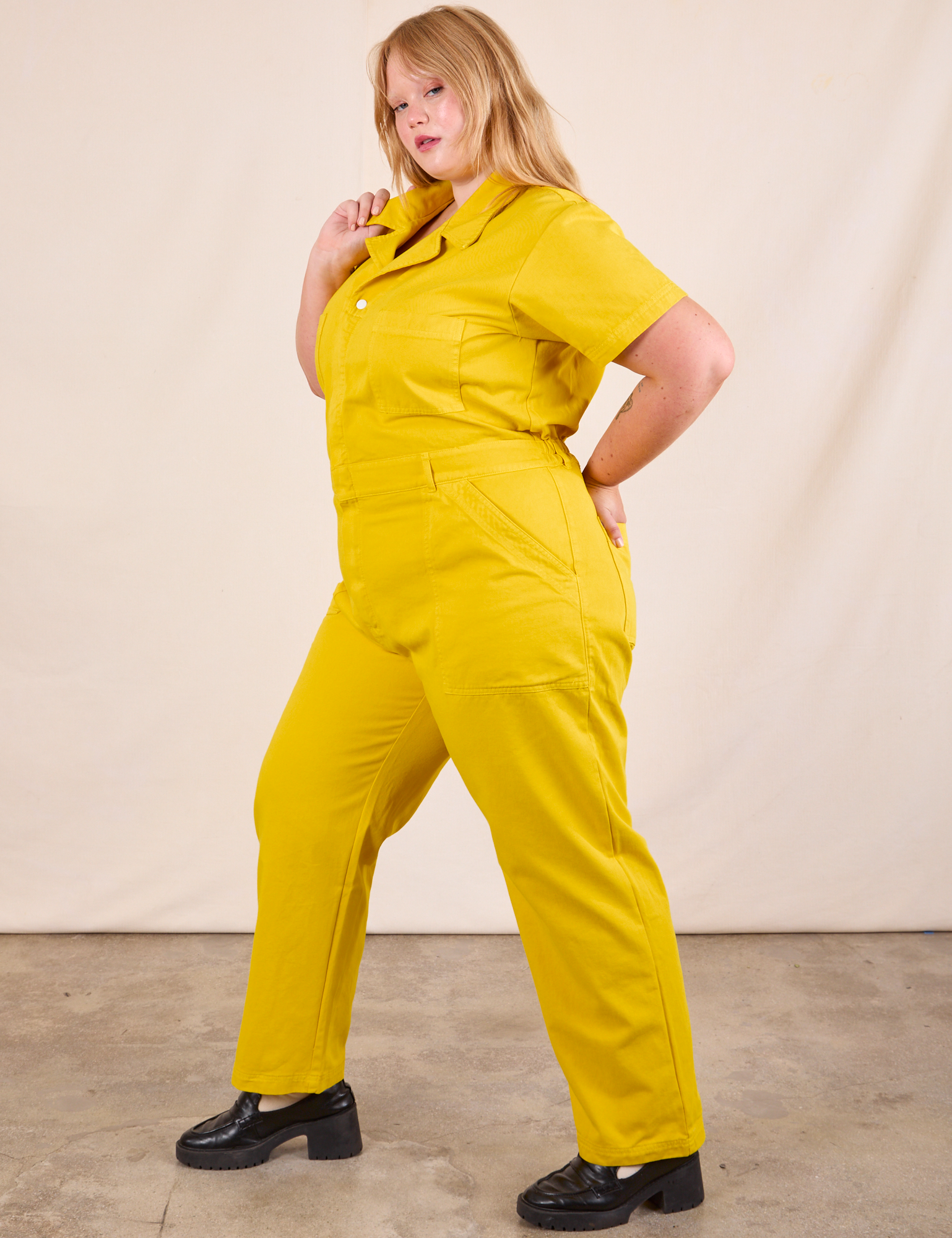 Short Sleeve Jumpsuit in Golden Yellow side view on Juliet