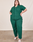 Marielena is 5’8” and wearing 2XL Short Sleeve Jumpsuit in Hunter Green