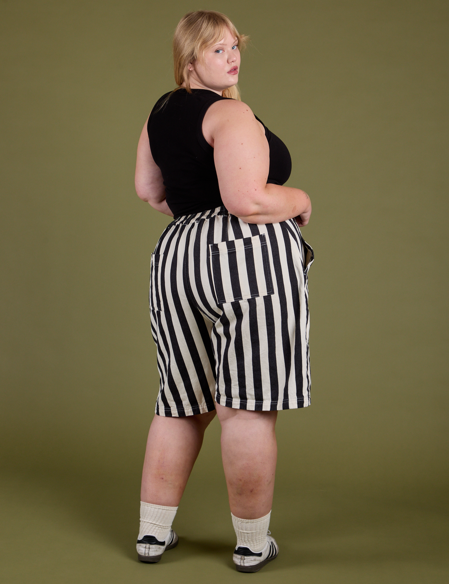 Longline Work Shorts in Natural angled back view on Juliet