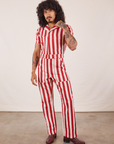 Jesse is 5'8" and wearing XS Cherry Stripe Jumpsuit