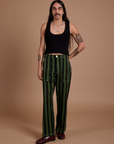 Anthony is 5’6” and wearing S Black Stripe Work Pants in Evergreen