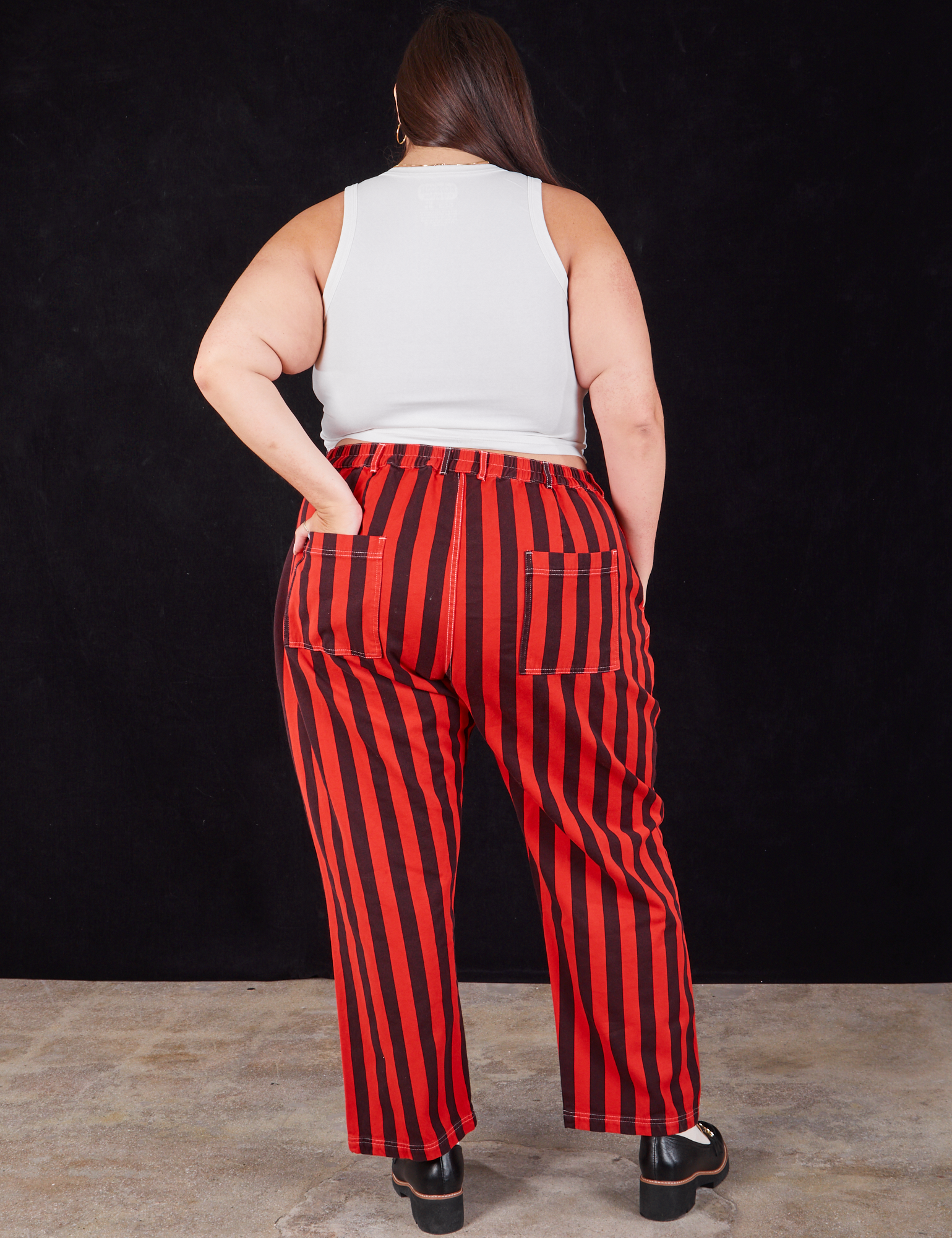 Black Stripe Work Pants in Mustang Red back view on Katie