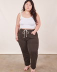 Ashley is 5'7" and wearing XL Cropped Rolled Cuff Sweatpants in Espresso Brown paired with vintage off-white Cami