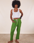 Jerrod is 6'3" and wearing M Cropped Rolled Cuff Sweatpants in Lawn Green paired with vintage off-white Cropped Tank Top
