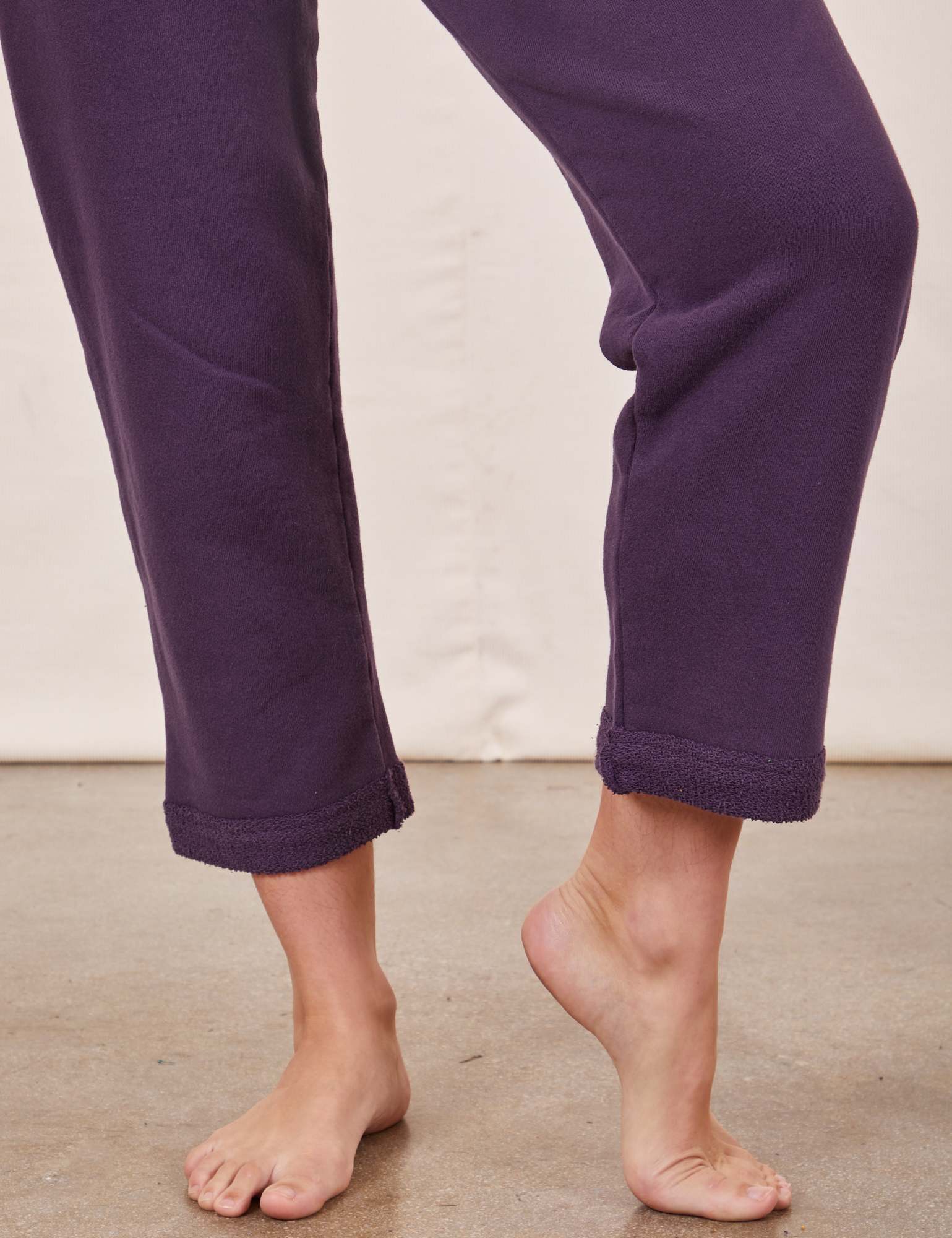 Cropped Rolled Cuff Sweatpants in Nebula Purple pant leg close up on Alex