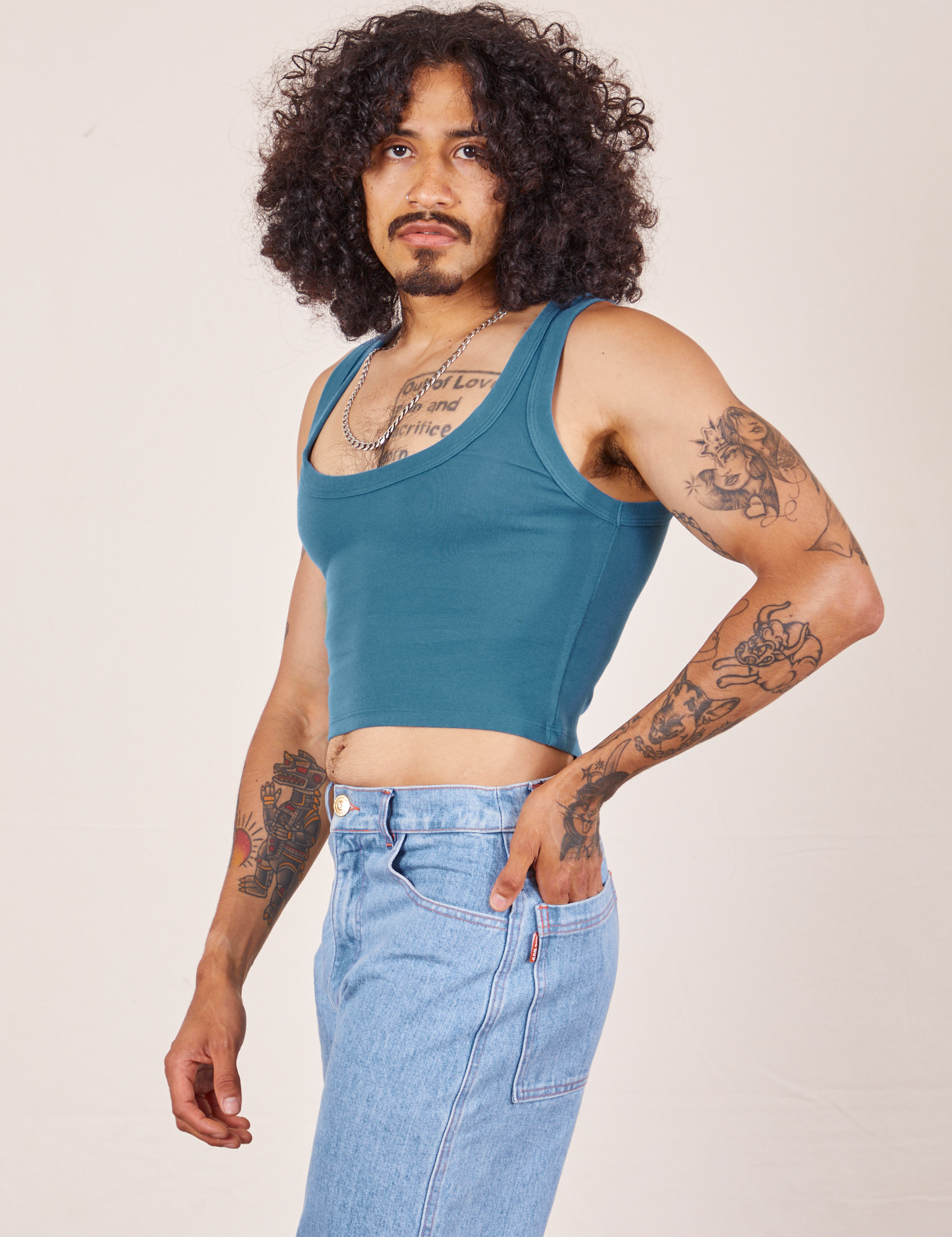 Angled view of Cropped Tank Top in Marine Blue worn by Jesse