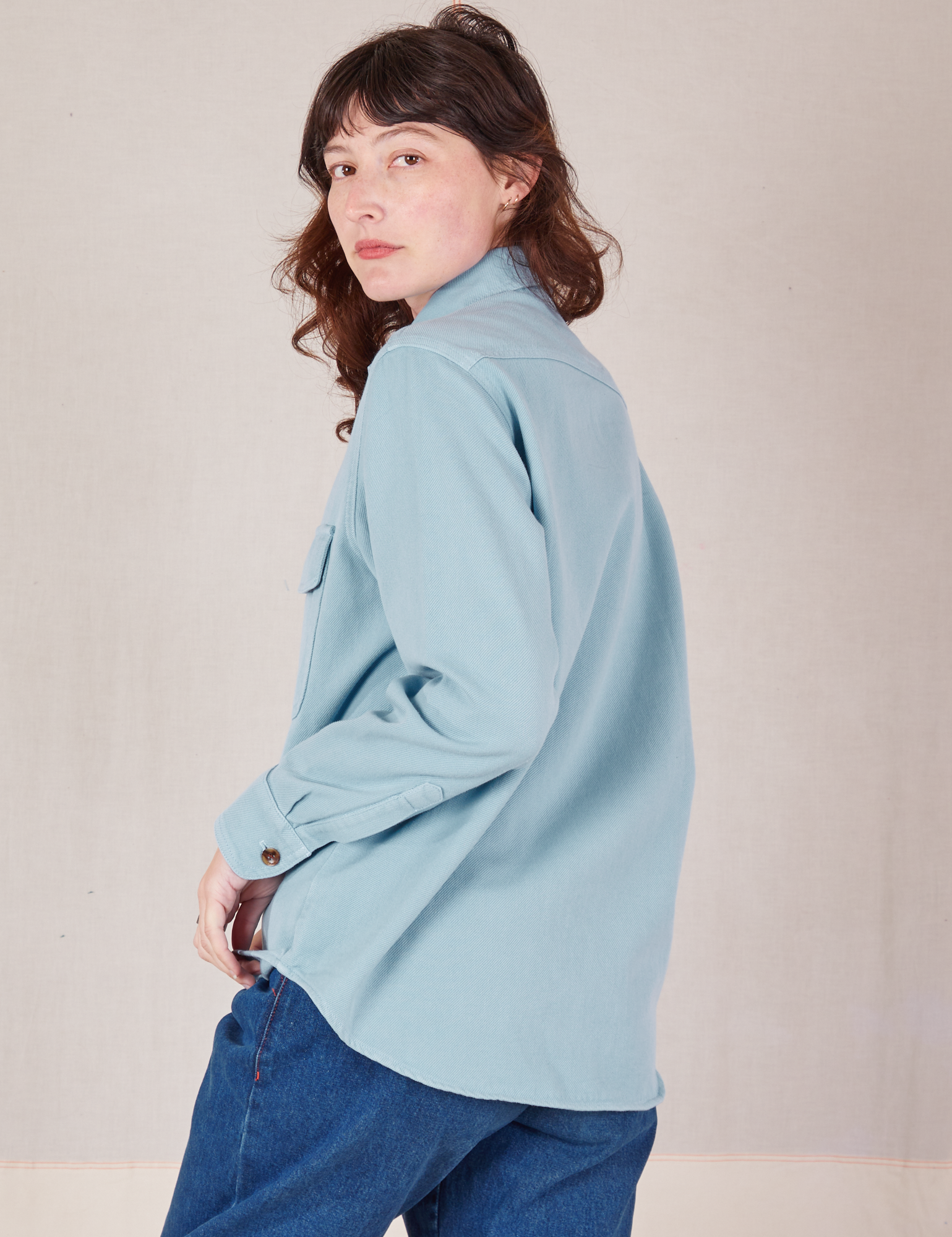 Angled back view of Flannel Overshirt in Baby Blue on Alex