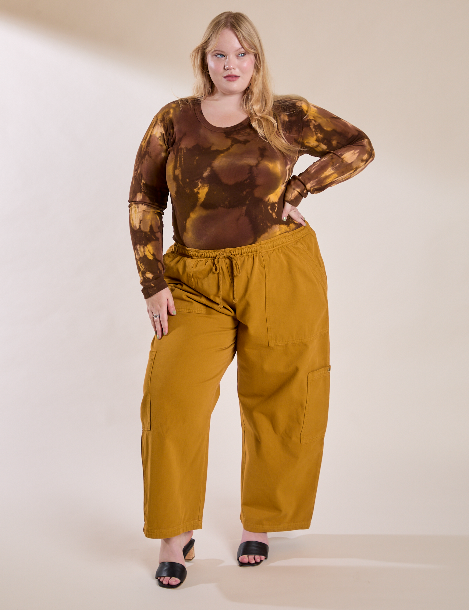Juliet is wearing Long Sleeve Baby Tee in Honey Brown and spicy mustard Drop Pocket Cargo Pants