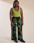 Demi is 5'6" and wearing S Magic Waters Drop Pocket Pants in Green Pool paired with a gross green Cropped Tank