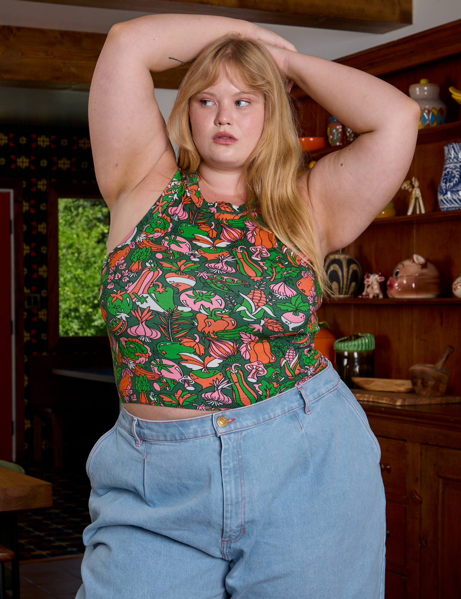 Juliet is 5&#39;7&quot; and wearing L Kitchen Collection Racerback Tank
