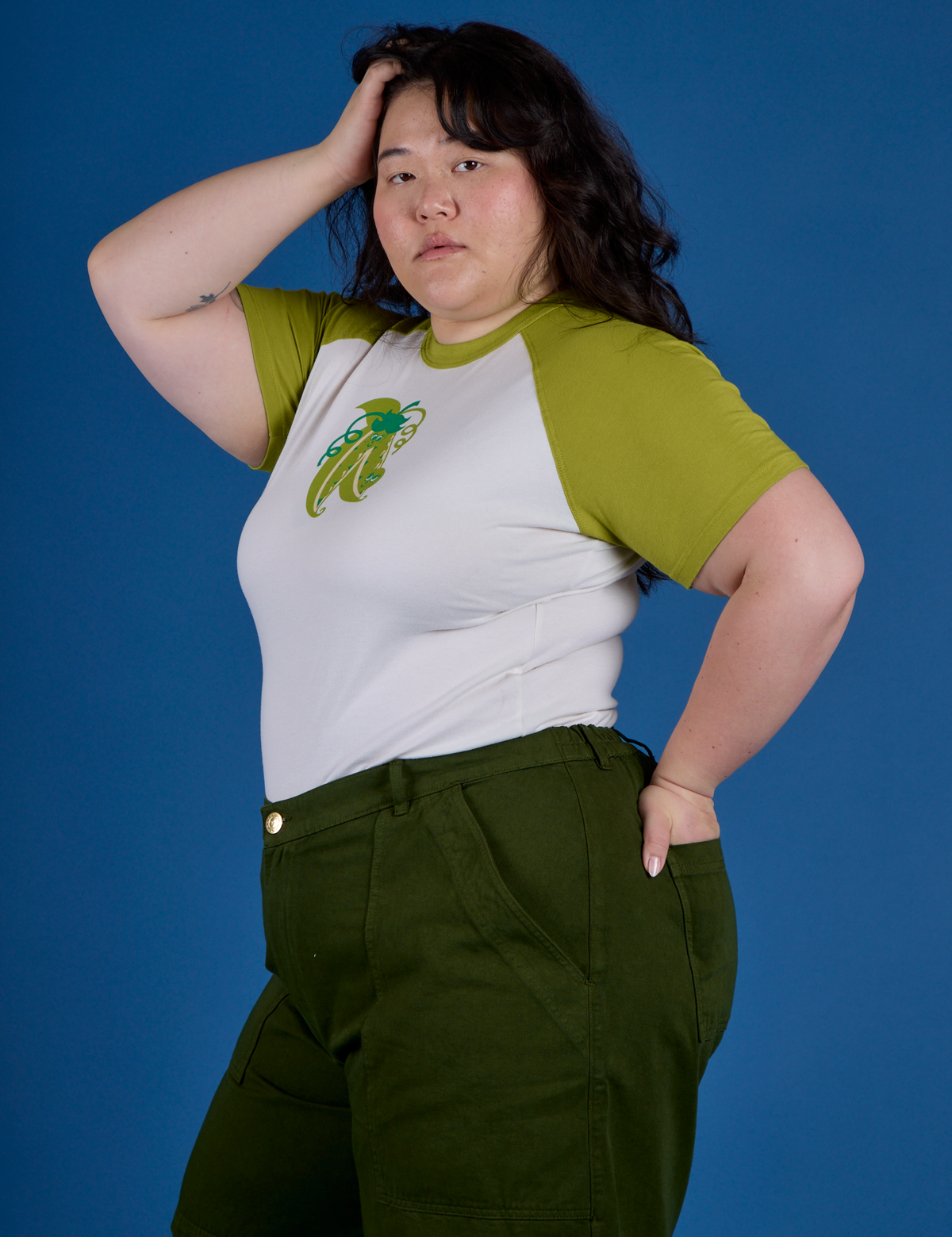 Side view of Produce Raglan Tee in Snap Peas on Ashley