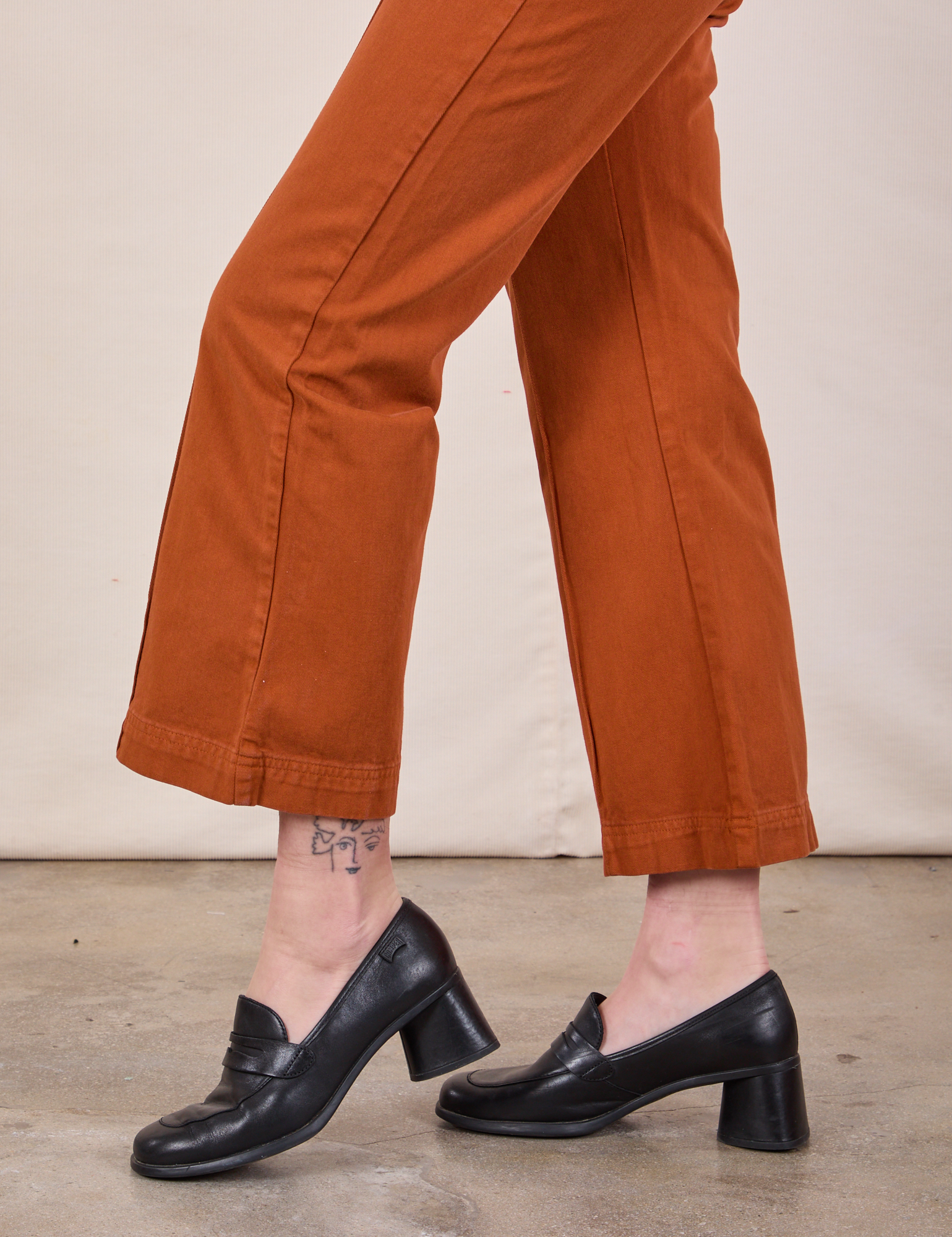 Western Pants in Burnt Terracotta pant leg close up on Alex