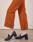 Western Pants in Burnt Terracotta pant leg close up on Alex