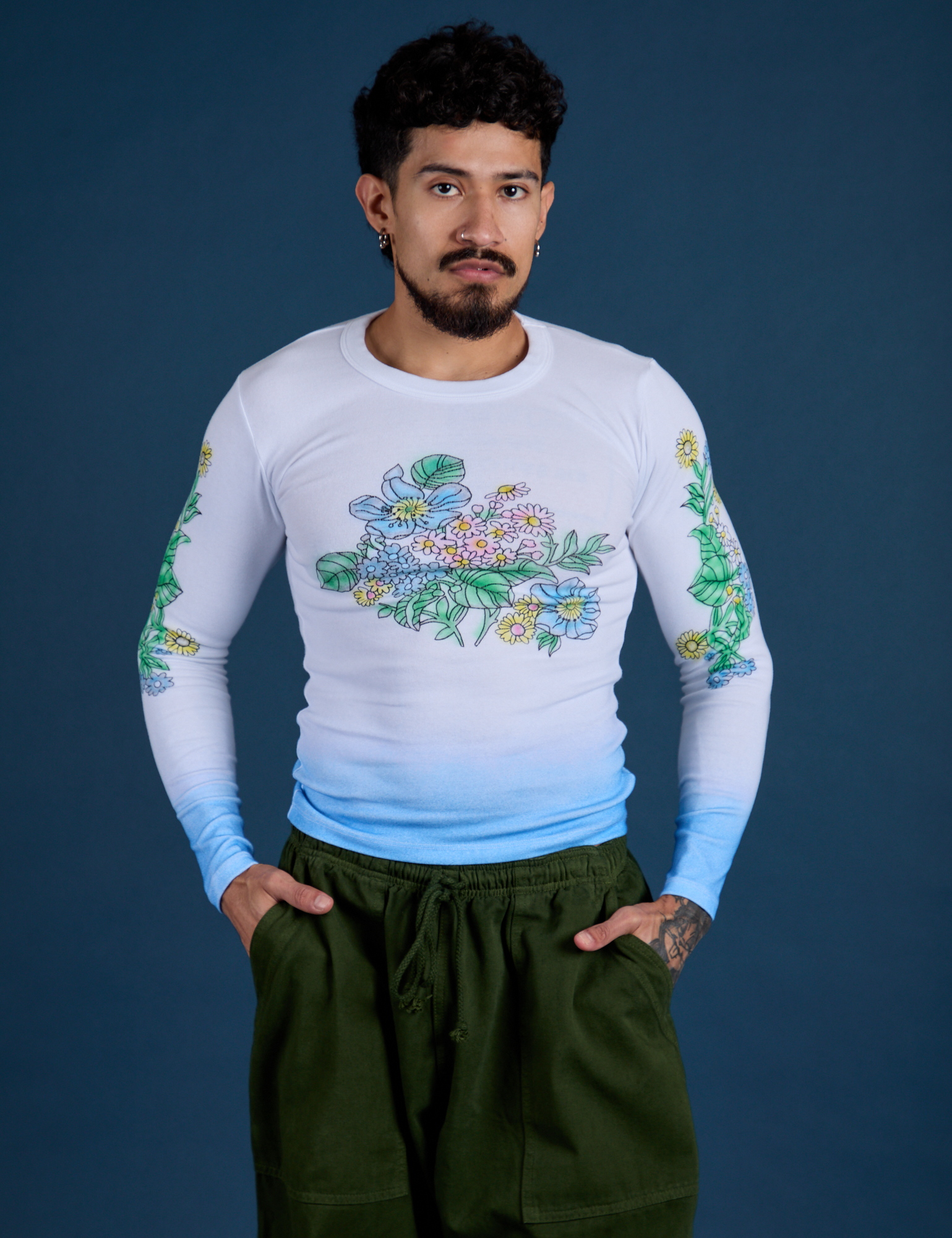 Jesse is 5’7” and wearing S Floral Long Sleeve Baby Tee in Baby Blue